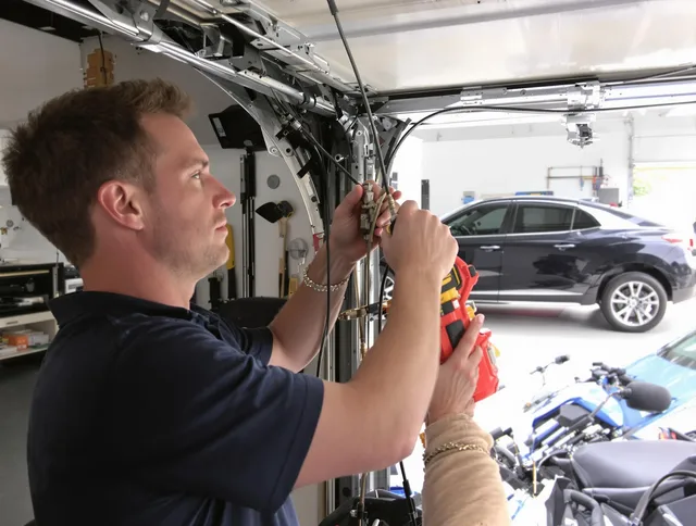 Lincoln Garage Door Repair safety certified technician performing cable replacement in Lincoln