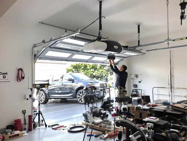 Lincoln Garage Door Repair specialist installing smart garage door opener system in Lincoln home